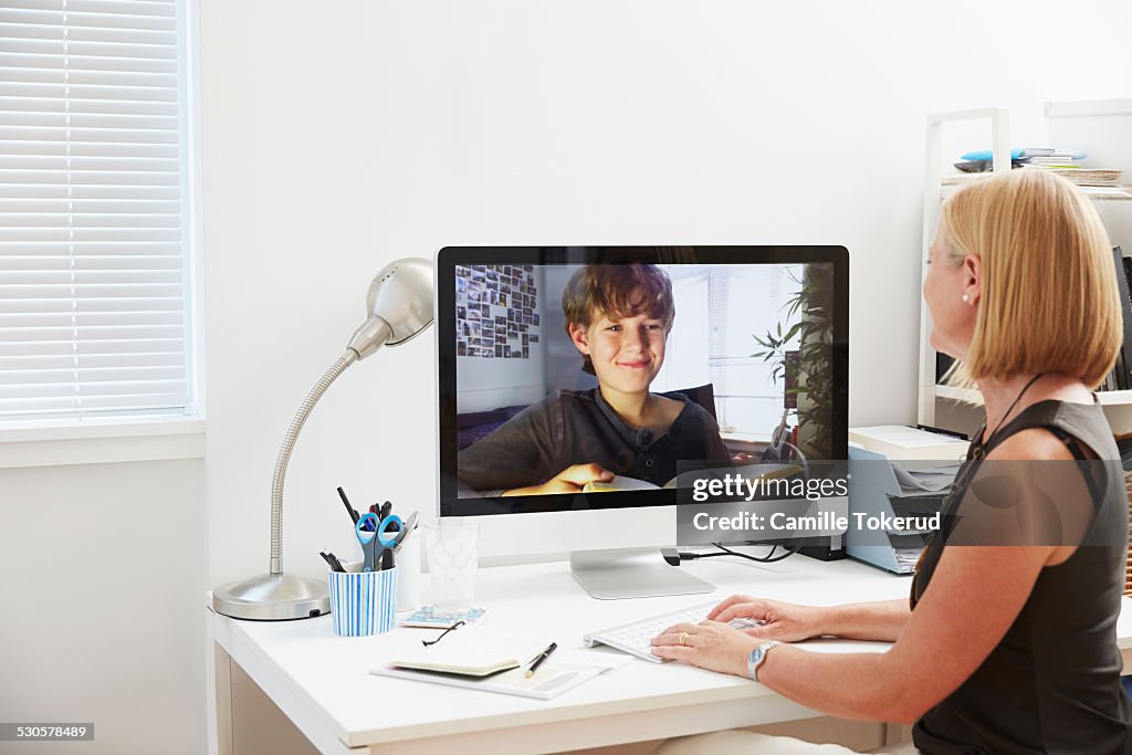 Mother and Son seeing each other over computer