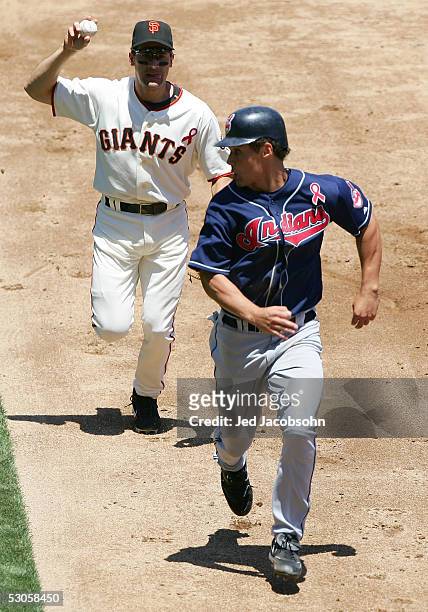 Grady Sizemore of the Cleveland Indians is caught in a rundown as shortstop Omar Vizquel of the San Francisco Giants throws to first at SBC Park on...