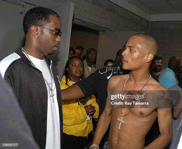 Recording artists, Sean P. Diddy Combs , and TI, attend the VIBE Music Festival at the Georgia Dome on June 11, 2005 in Atlanta, Georgia.