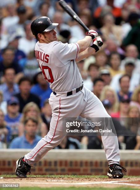 Kevin Youkilis of the Boston Red Sox hits a solo home run in the first inning against the Chicago Cubs on June 12, 2005 at Wrigley Field in Chicago,...