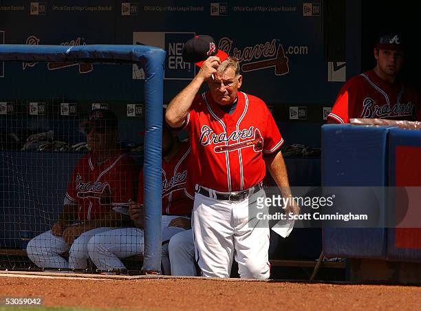 Manager Bobby Cox of the Atlanta Braves scratches his head during the game against the Oakland Athletics at Turner Field on June 12, 2005 in Atlanta,...