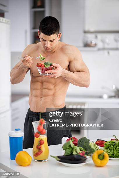 shirtless man in the kitchen - extreme dieting stock pictures, royalty-free photos & images