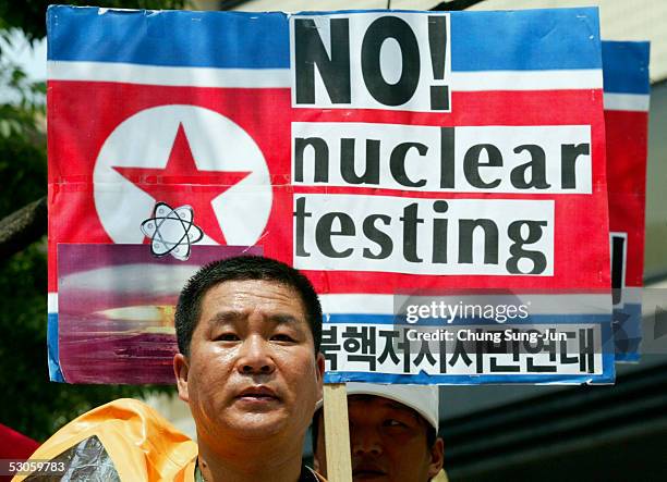 Conservative protester carries an anti-North Korean placard during an anti-North Korea rally on June 13, 2005 in Seoul, South Korea. U.S. President...