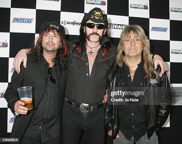 Members of Motorhead, Phil Campbell, Lemmy Kilminster and Mikkey Dee pose backstage at the third and final day of this year's Download Festival at...