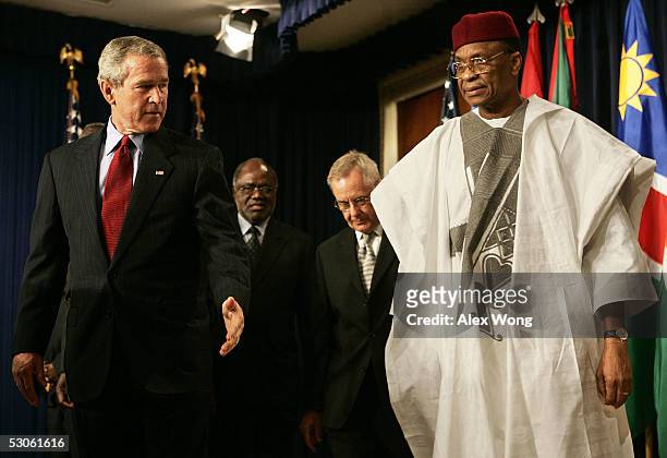 President George W. Bush shows President of Niger Mamadou Tandja where to stand prior to making a statement on Africa June 13, 2005 at the Eisenhower...