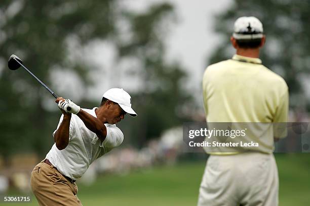 Tiger Woods of the USA is watched by his coach, Hank Haney, during practice prior to the start of the US Open on June 13, 2005 at the Pinehurst...
