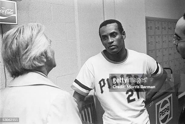 Roberto Clemente of the Pittsburgh Pirates talks to the media after getting his 3000th hit against the New York Mets at Three Rivers Stadium on...