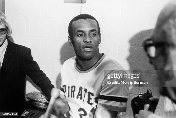 Roberto Clemente of the Pittsburgh Pirates talks to the media after getting his 3000th hit against the New York Mets at Three Rivers Stadium on...