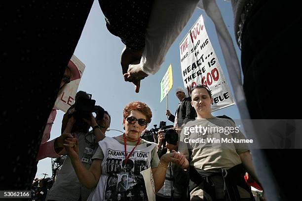 Michael Jackson fans hold hands a pray out front the courthouse while waiting for a verdict in the Michael Jackson child molestation trial at the...