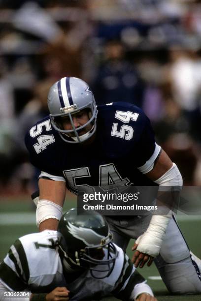 Linebacker Randy White, of the Dallas Cowboys, stands up after sacking quarterback Ron Jaworski, of the Philadelphia Eagles during a game on November...