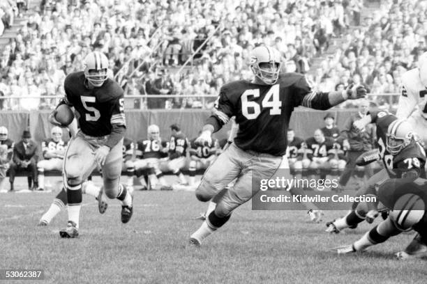 S: Runningback Paul Hornung and Jerry Kramer, of the Green Bay Packers, run the "Lombardi Sweep" during a game in the 1960's against the St. Louis...