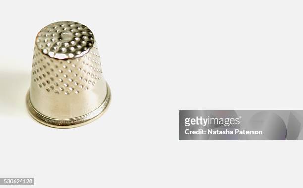 metal thimble - thimble stock pictures, royalty-free photos & images