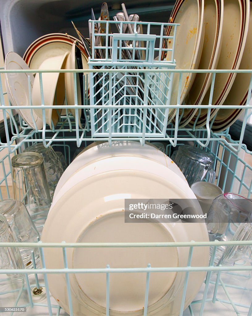Dirty Dishes On Dishwasher Racks High-Res Stock Photo - Getty Images