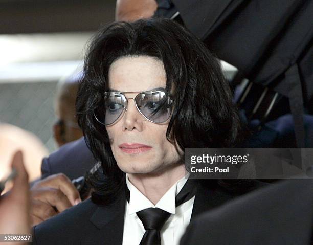 Michael Jackson prepares to enter the Santa Barbara County Superior Court to hear the verdict read in his child molestation case June 13, 2005 in...