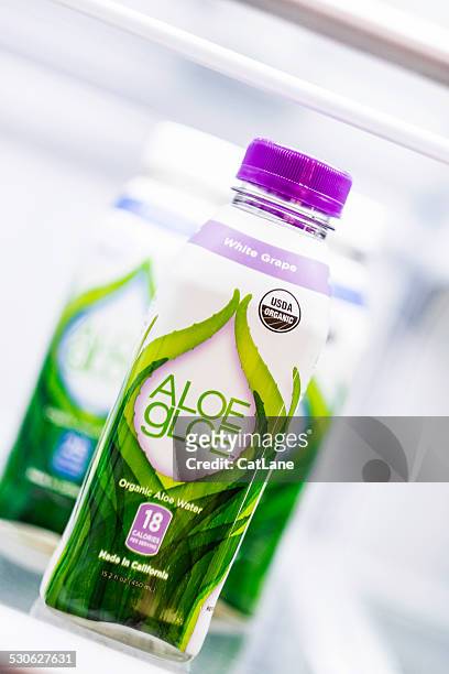 bottled aloe gloe hydration drinks in a refrigerator - americana aloe stock pictures, royalty-free photos & images