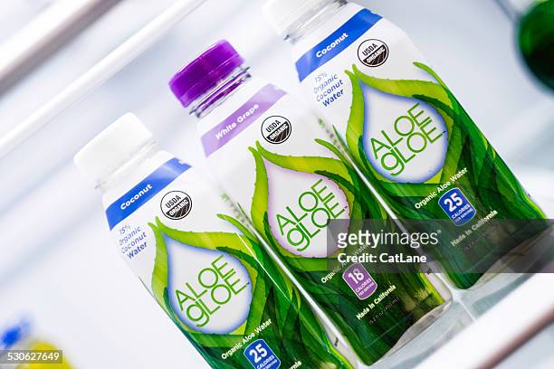 bottled aloe gloe hydration drinks in a refrigerator - americana aloe stock pictures, royalty-free photos & images