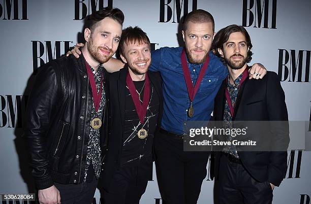 Musicians Daniel Platzman, Ben McKee, Dan Reynolds and Daniel Wayne Sermon of Imagine Dragons arrives at the 64th Annual BMI Pop Awards at the...