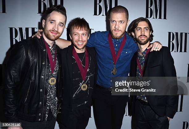 Musicians Daniel Platzman, Ben McKee, Dan Reynolds and Daniel Wayne Sermon of Imagine Dragons arrives at the 64th Annual BMI Pop Awards at the...