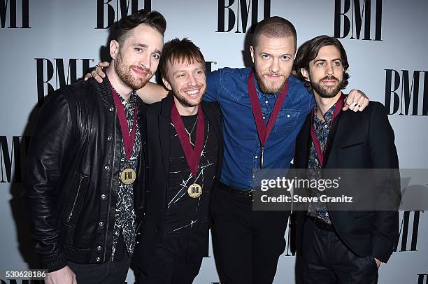 Musicians Daniel Platzman, Ben McKee, Dan Reynolds and Daniel Wayne Sermon of Imagine Dragons arrives at the 64th Annual BMI Pop Awards at the...