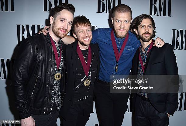 Musicians Daniel Platzman, Ben McKee, Dan Reynolds and Daniel Wayne Sermon of Imagine Dragons arrives at the 64th Annual BMI Pop Awards at the...