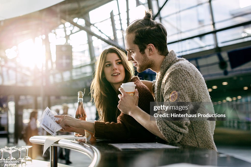 Young Backpacker Couple At The Airport