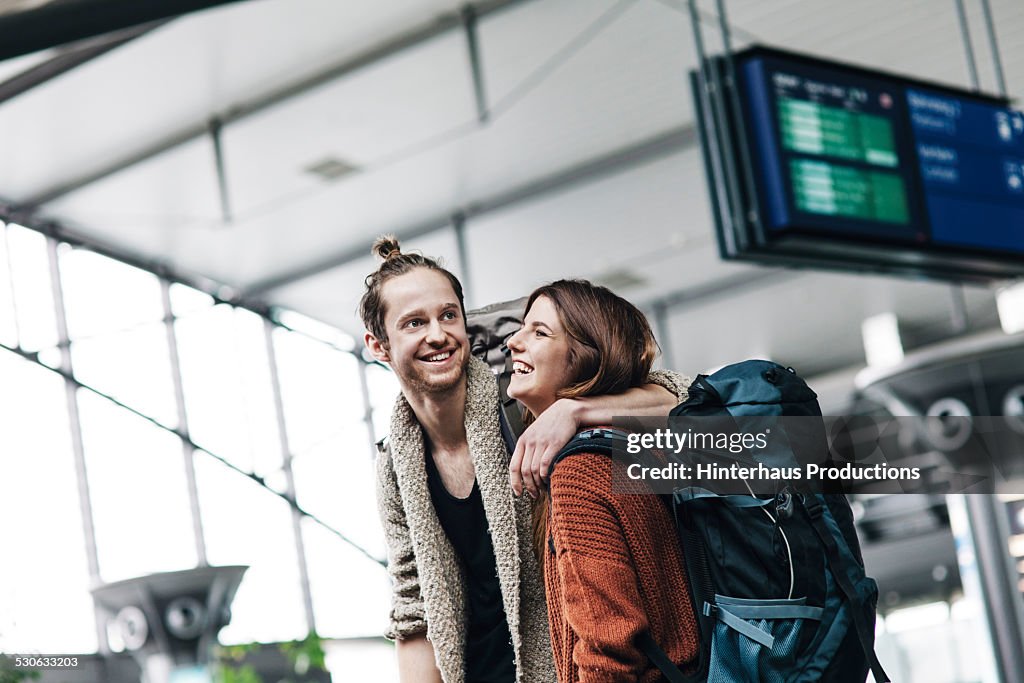 Young Backpacker Couple At The Airport