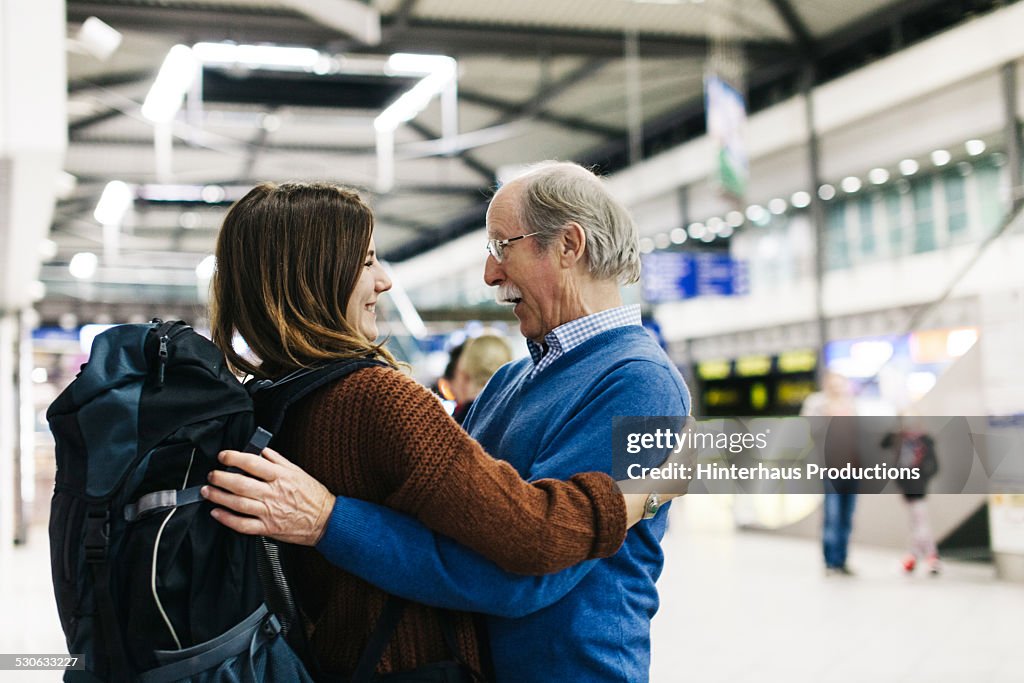 Grandfather Welcoming Young Traveller