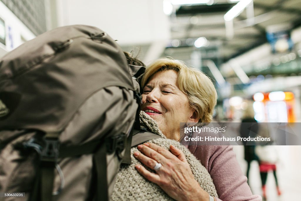 Grandmother Welcoming Young Traveller