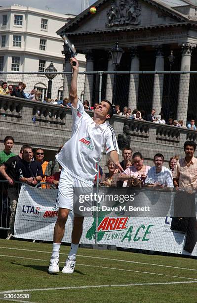 Tennis player Tim Henman participates in the Ariel Celebrity Tennis Match held in Trafalgar Square June 13, 2005 in London, England.