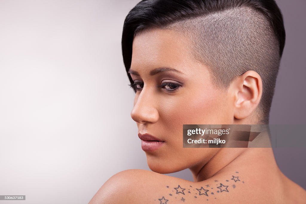 Portrait of  beautiful girl with a Mohawk hairstyle