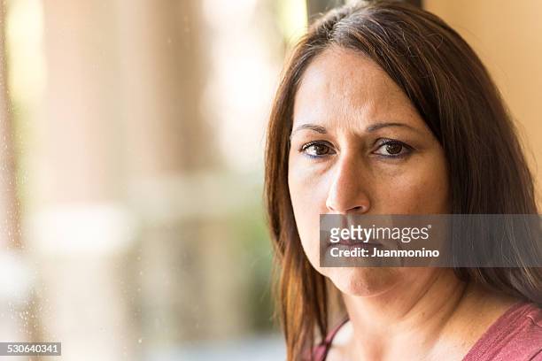 pensive mature woman - portrait woman 50 serious stockfoto's en -beelden