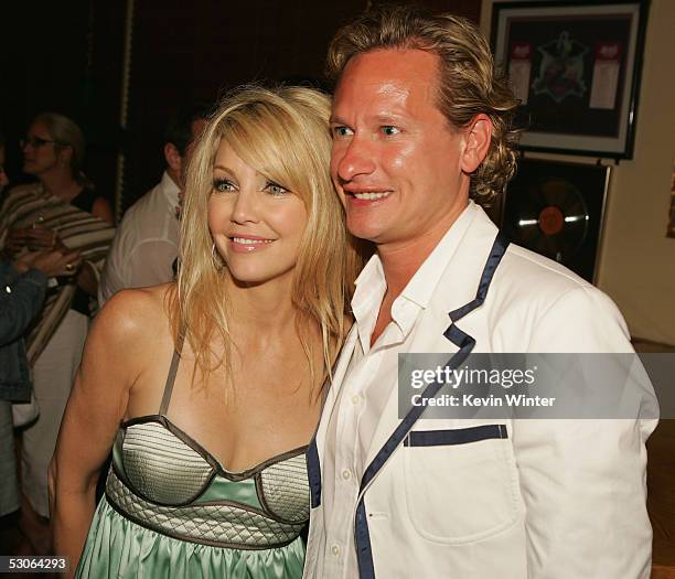 Actors Heather Locklear and Carson Kressley pose at the afterparty for the premiere of Universal Picture's "The Perfect Man" at the Hard Rock Cafe on...