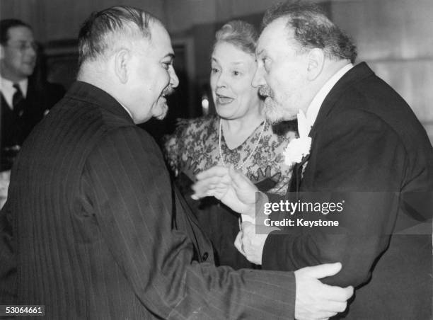 Ivan Mikhailovich Maisky , the Soviet Ambassador to Britain chats with conductor Sir Henry Wood and Lady Wood at a party held by the BBC to...