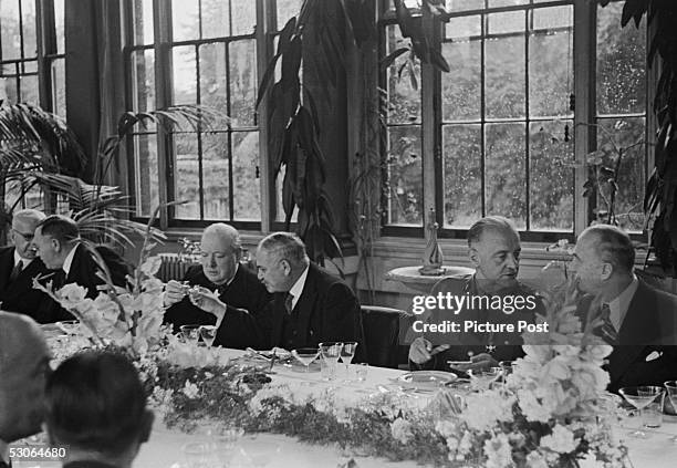 Guests at a lunch party in the Winter Garden of the Soviet Embassy in London, given by Soviet Ambassador Ivan Maisky , August 1941. Maisky clinks...