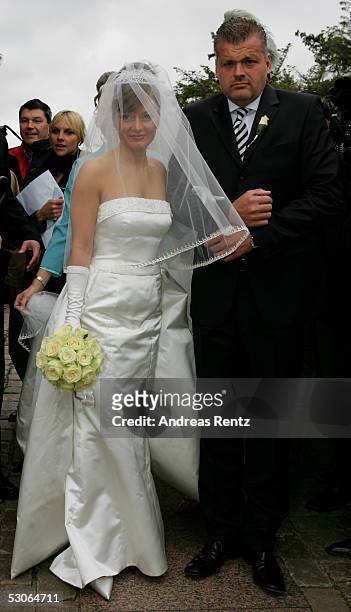 Alexandra Stich , maiden name Rikowski and her witness to a marriage Thomas Wittlage pose for a photograph at the Sankt Severin church on June 11,...