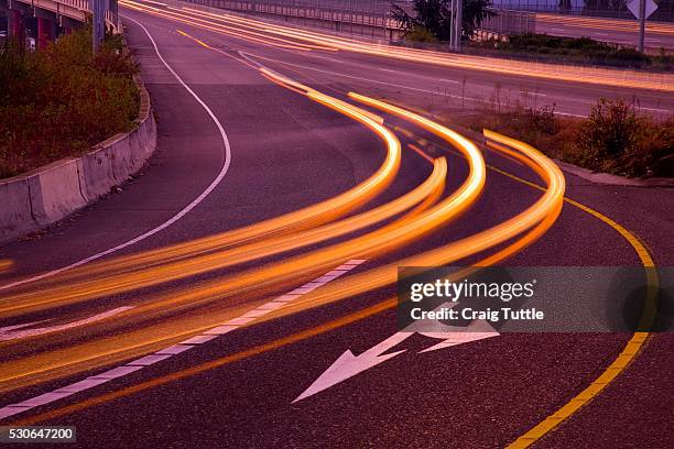 blurred headlights on freeway - swift tuttle stock pictures, royalty-free photos & images