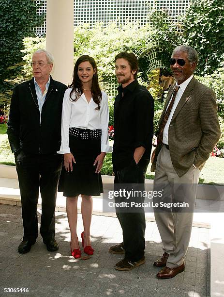 Actress Katie Holmes poses with actors Michael Caine Christian Bale and Morgan Freeman during a photocall for Batman begins on June 14, 2005 in...