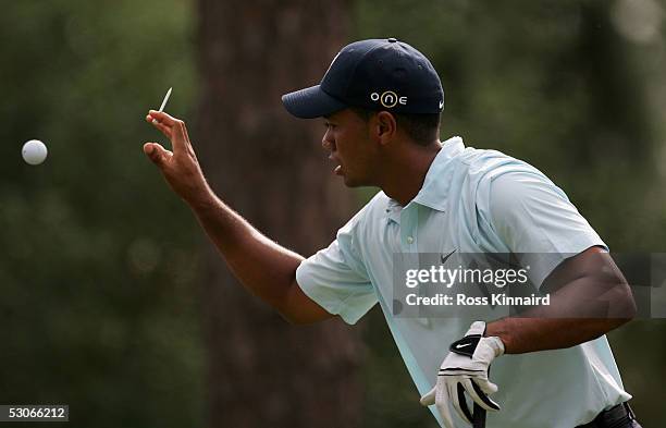 Tiger Woods of the USA tees up a second ball on the par four 11th hole during practice prior to the start of the U.S. Open at the Pinehurst Resort on...