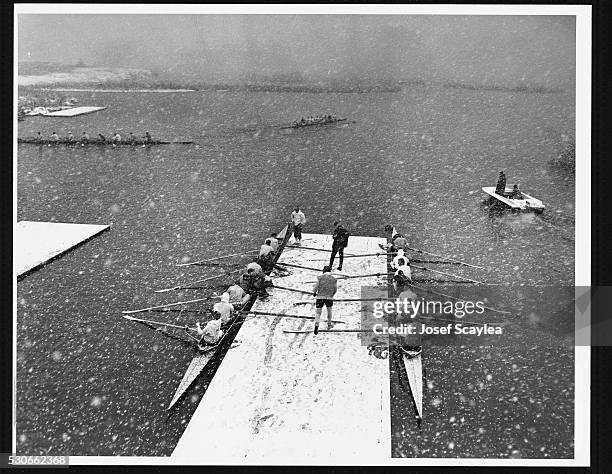 Snow falling from a March blizzard doesn't prevent the University of Washington rowing crew from working out on Lake Washington.