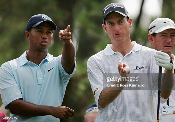 Tiger Woods and Jim Furyk wait to play on the par four 11th hole during practice prior to the start of the U.S. Open at Pinehurst Resort June 14,...