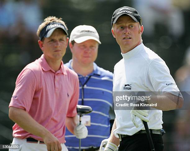 Simon Dyson of England tees off on the par four 13th hole as Luke Dodald looks on during practice prior to the start of the U.S. Open at Pinehurst...