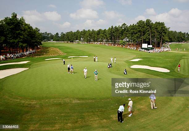 Tiger Woods chips on the 12th green during practice prior to the start of the U.S. Open at Pinehurst Resort June 14, 2005 in Pinehurst, North...