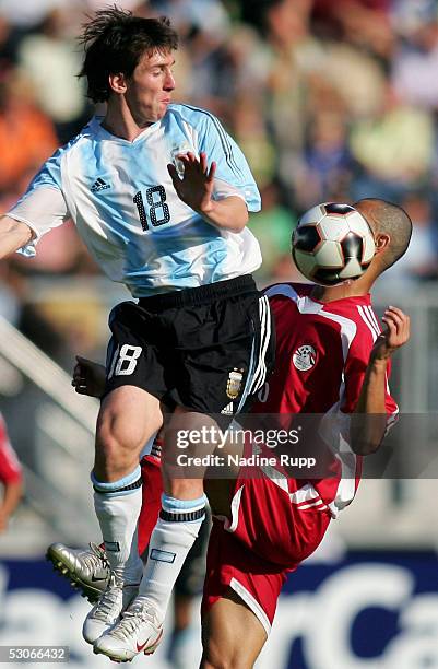 Abdellah Gala of Egypt is challenged by Lionel Messi of Argentina during the FIFA World Youth Championship match between Egypt and Argentina on June...
