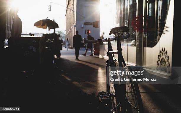 backlit bicycle - hot dog cart stock pictures, royalty-free photos & images