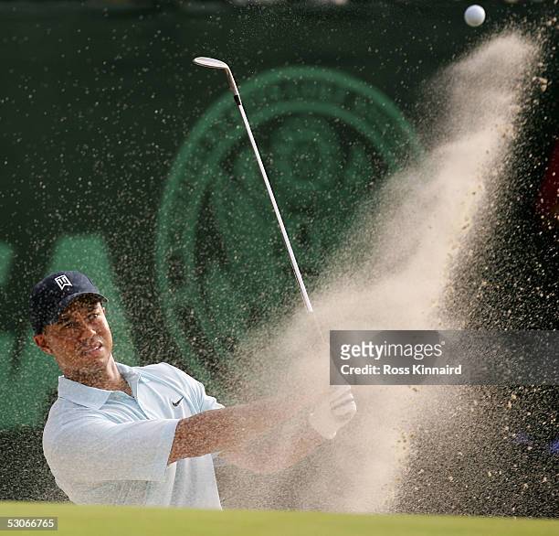 Tiger Woods of the USA plays from bunker on the par four 7th hole during practice prior to the start of the U.S. Open at the Pinehurst Resort on June...