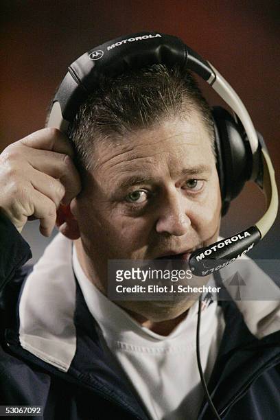 Offensive coordinator Charlie Weis of the New England Patriots looks on against the Miami Dolphins during the game at Pro Player Stadium on December...