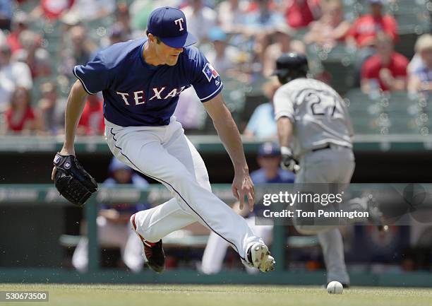 Cole Hamels of the Texas Rangers fields a line drive against Dioner Navarro of the Chicago White Sox in the bottom of the third inning at Globe Life...