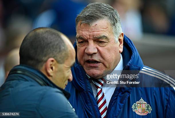 Sam Allardyce, manager of Sunderland and Roberto Martinez, manager of Everton in conversation during the Barclays Premier League match between...