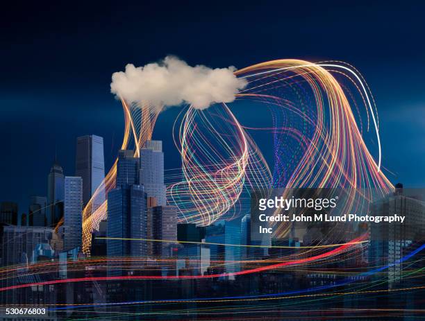 illuminated light trails and cloud over cityscape - cloud computing architecture stock pictures, royalty-free photos & images
