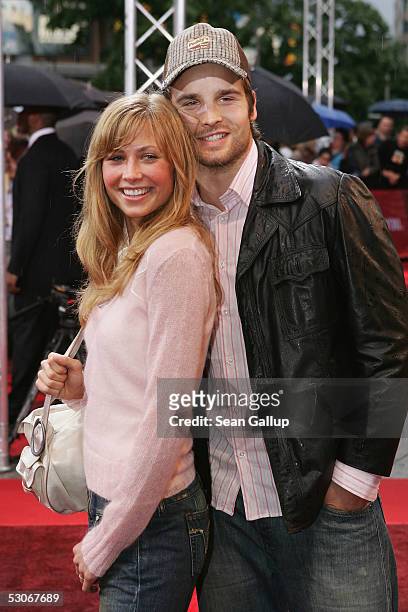 German singer Patrick Nuo and his girlfriend, actress Molly Schade arrive for the German premiere of "War of the Worlds" at the Theater am Potsdamer...